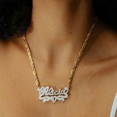 Our popular Frosted Double Plated Heart Name Necklace boasts a chic and elegant design, handcrafted to perfection. The model showcases the necklace with an 18-inch XO chain (see video for reference). You can personalize this item with Letters, Numbers, and Roman Numerals and choose from chain lengths of 14", 16", 18", and 20". Each chain features a lobster clasp closure for secure wear.Chain width:Cuban Chain - 3.7 mmFigaro Chain - 3 mm Elegant Heart Pendant Necklace With Figaro Chain, Elegant Jewelry With Figaro Chain And Heart Pendant, Elegant Heart Shaped Figaro Chain Necklace, Elegant Heart-shaped Figaro Chain Necklace, Custom Heart Pendant Necklace For Anniversary, Metal Name Necklace With Adjustable Chain Pendant, Elegant Heart-shaped Name Necklace With Adjustable Chain, Metal Pendant Name Necklace With Adjustable Chain, Metal Heart Necklace With Chain For Anniversary