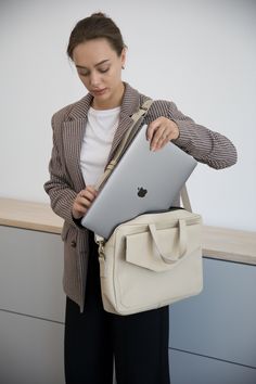 Introducing our women's leather laptop bag, the perfect blend of style and functionality. Designed specifically for women, this laptop tote bag is crafted from luxurious leather, allowing you to carry your laptop in utmost elegance.  Whether you're heading to the office or a business meeting, this leather laptop bag is a must-have accessory that combines practicality with timeless sophistication. Upgrade your professional look with our women's leather laptop bag today. Optionally, you can make c Luxury Briefcase For Business, Luxury Leather Briefcase For Gift, Large Capacity Laptop Bag For Daily Use, Beige Tote Laptop Bag With Removable Pouch, Chic Large Capacity Laptop Bag For Daily Use, Chic Laptop Bag With Large Capacity For Daily Use, Large Capacity Laptop Shoulder Bag For Daily Use, Everyday Beige Leather Laptop Bag, Trendy Large Capacity Satchel Laptop Bag