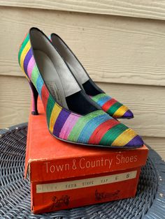 Rainbow vintage Town & Country heels, 4 in heel, size 6 women's, with original box. Condition: these heels are in excellent condition and look like they've hardly been worn! Vintage items are often pre-owned. I do my best to report condition accurately, if you feel as though I have misrepresented an item please contact me immediately. I will do what I can to work with you and figure out how to remedy any grievances.  House Savvy is not responsible for lost or stolen packages, but I will do my best to ensure your package reaches you safely. I will ship through USPS/mail carrier, and all packages are insured through them. Please make sure that all addresses on your order or correct. I will not be able to make accommodations for packages delivered to wrong address due to incorrect address upo Vintage 4-inch Heels, Retro High Heels For Vintage Fashion, Retro High Heel Heels For Vintage Fashion, Retro Pointed Toe Heels For Vintage Fashion, Retro Pointed Toe Heels For Vintage Occasions, Retro Heels With Pointed Toe For Vintage Fashion, Retro Almond Toe Heels With 4-inch Heel, Vintage Multicolor High Heels, Retro 4-inch Heels For Party