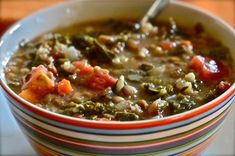 a bowl filled with soup sitting on top of a table