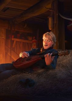 a young boy sitting on top of hay holding a guitar