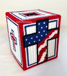 a red, white and blue beaded box with an american flag on the front