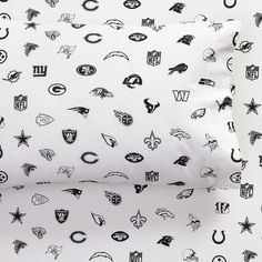 two pillow cases with black and white nfl logos on them