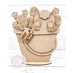 a wooden cutout of a flower pot with teddy bears and hearts on the top