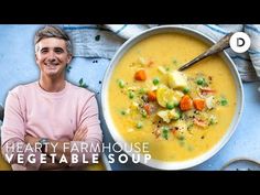 a man standing in front of a bowl of food with the words hearty farmhouse vegetable soup