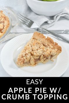 an easy apple pie w / crumb topping on a white plate next to a bowl of apples