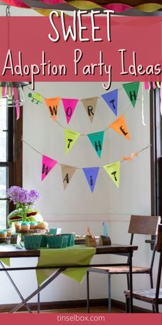 a party with bunting and colorful flags hanging from the ceiling