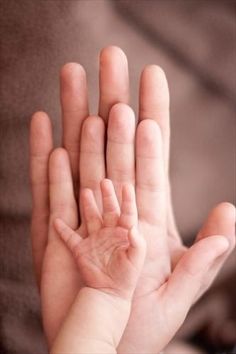 a black and white photo of a person's hand