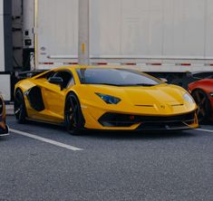 three different colored sports cars parked next to each other