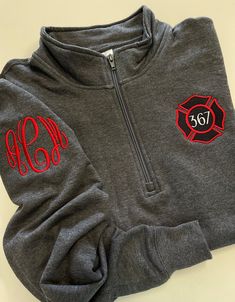 "This cute design is perfect to celebrate any firefighter and makes a perfect staple for your own wardrobe or as a gift!  All of our items are made on high quality products, not lower end pieces. We offer the design shown in the main listing photo on unisex quarter zip sweatshirts and four different types of full-zip jackets available in ladies cut and unisex sizing.  See below for comments on sizing.  To see all of our firefighter designs click here: https://www.etsy.com/shop/DoubleStitchDesign Funny Firefighter Shirts, Firehouse Decor, Embroidering Ideas, Women Firefighters, Firefighter Wife Shirt, Firefighters Wife, Firefighter Shirt, Firefighter Apparel, Firefighter Emt