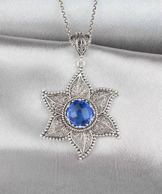 Elevate your style with this stunning handcrafted Sterling Silver Filigree Art Blue Quartz Gemstone Women's Pendant Necklace. The intricate filigree design is crafted from high-quality 925 sterling silver, while the mesmerizing blue quartz gemstone adds a touch of sophistication to this standout piece. Expertly crafted by skilled artisans, this pendant necklace is a true work of art that is perfect for any occasion. Whether you're dressing up for a special event or adding a touch of elegance to Blue Star-shaped Bohemian Jewelry, Blue Star-shaped Gemstone Necklace, Handmade Elegant Star Of David Jewelry, Gift Jewelry With Sapphire Filigree, Elegant Blue Star-shaped Jewelry, Blue Gemstone Star Of David Jewelry, Blue Star Of David Gemstone Jewelry, Blue Star Of David Jewelry Gift, Blue Filigree Pendant Jewelry