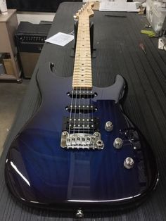 an electric guitar sitting on top of a table