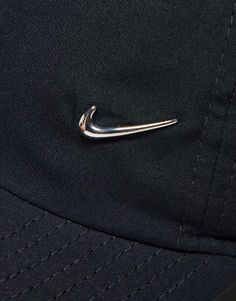 a baseball cap with a metal hook on it