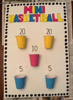 a bulletin board with cups on it and the words mini basketball written in large letters