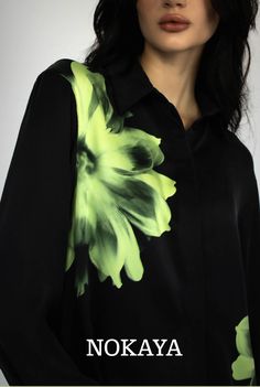 The silk shirt's aesthetic energy lies in its large-scale floating flowers, which catch your attention with their fluent greenery—a unique mix of vivid and pastel shades. 
The mix-and-match capsule invites you to create the set that best fits your style. Add shorts or pants with a flower print to get the total look, or just black to a lower degree. Limited collection is online. Shop now. Black Silk Pajamas, Black Silk Shirt, Green Pastel, Dressing Gown Robe, Floating Flowers, Nightwear Women, Silk Camisole, Loungewear Women, Luxury Silk