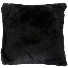 the black pillow is made from faux fur and has a square shape with an uneven edge