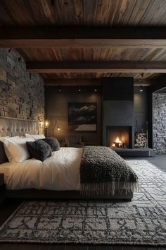 a large bed sitting next to a fireplace in a bedroom