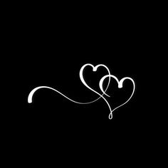 two white hearts on a black background with the word love written in it's center