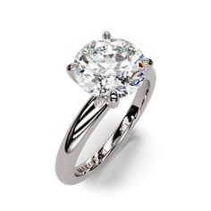 a white gold engagement ring with an oval cut diamond