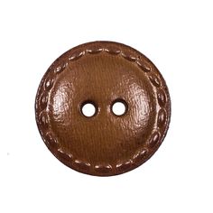 a brown leather button with two holes in the middle and one hole at the bottom