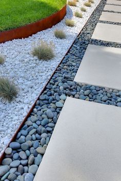 an outdoor area with gravel, rocks and grass