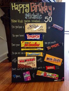 a chalk board with candy bars on it