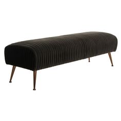 an upholstered bench with wooden legs and a black velvet cover on the back