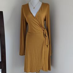 Brand New, Never Word With Tags. Super Cute Deep Plunge Faux Wrap Dress. The Color Is A Deep Mustard Yellow, A Great Addition For Your Fall Wardrobe. Faux Wrap Dress For Night Out In Fall, Faux Wrap Dress For Fall Night Out, Wrap Dresses For Night Out In Fall, Wrap Dresses For Fall Night Out, Fall Wrap Midi Dress For Date Night, Wrap Midi Dress For Date Night In Fall, Fitted Wrap Dress For Day Out, Fall Mini Dress With Tie Waist And Surplice Neckline, Faux Wrap Dress For Date Night In Fall