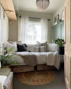 a living room filled with furniture and plants