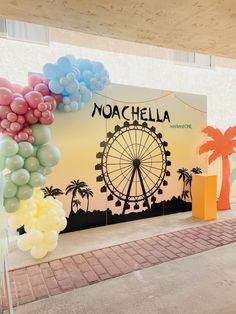 there is a large balloon display in front of the sign that says noachella