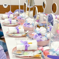 the table is set with towels, plates and other items for an event or baby shower