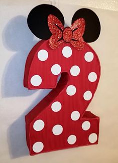 the number two is decorated with minnie mouse ears