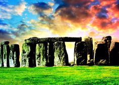 the stonehenge monument in england against a colorful sky with clouds and grass below