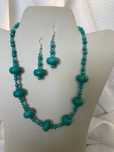 Stone and Glass Blue Beaded Necklace and Earring Set. Length 17 Inches. Perfect for gift to mom and wife. Turquoise Faceted Beads Costume Jewelry, Turquoise Czech Glass Bead Jewelry, Turquoise Czech Glass Round Beads Jewelry, Gift Turquoise Earrings With Polished Beads, Turquoise Oval Beads Jewelry For Gift, Turquoise Jewelry With Large Beads For Gift, Turquoise Oval Beads Jewelry As A Gift, Turquoise Faceted Beads Jewelry In Czech Glass, Gift Turquoise Jewelry With Large Beads