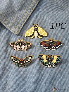 four different colored moths sitting on the back of a blue jean jacket, one is yellow and two are black