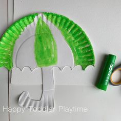 a paper plate with a green leaf on it