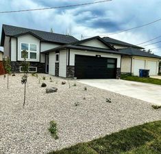 a house that has gravel in front of it