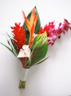 a bouquet of tropical flowers is displayed on an instagram page