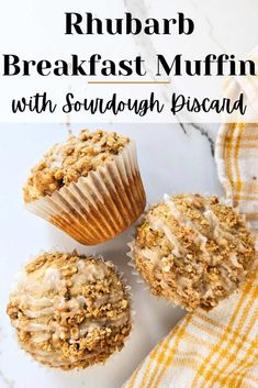 three muffins sitting on top of a white table