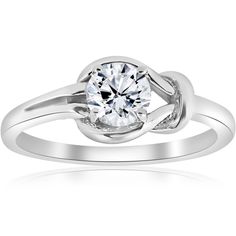 a white gold engagement ring with a round cut diamond in the center and an intertwined band