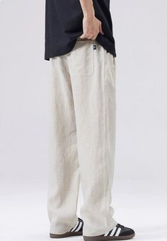 Discover the ultimate in comfort and style with our Slim Fit Elastic Waist Linen Trousers, perfectly blending functionality with a modern edge. Crafted from high-quality flax, these trousers offer a breathable and lightweight experience for all-day ease. The loose straight fit and solid color design evoke a sense of effortless sophistication, while the elastic waist provides a custom fit. Pocket decoration adds practicality and a touch of detail, making these trousers a go-to for any casual yet Flax Colored Bottoms With Pockets, Casual Flax Wide-leg Bottoms, Casual Flax-colored Cotton Bottoms, Casual Cotton Bottoms In Flax Color, Baggy Flax Pants With Pockets, Casual Wide-leg Flax Bottoms, Spring Flax Pants With Pockets, Linen Wide Leg Sweatpants With Pockets, Wide Leg Linen Sweatpants With Pockets