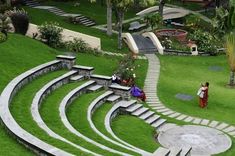 an aerial view of the steps leading up to a grassy area with people walking on it