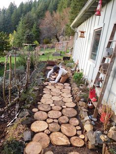 a man is building a path made out of logs