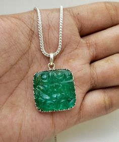 Thank you for coming in! Absolutely beautiful Zambian Emerald is like all colored gemstone. We can say that there are four types of gems find Color, Cut, Clarity, and Crystal. Emerald (Be3Al2Si6O18) is the grass-green type of Beryl. The formation of emerald involves a natural process known as exometamorphism. Stone Name:-> Zambian Emerald. Species/Group:-> Beryl. Origin:-> Zambia. Colour:-> Vivid Green. Product Type:-> Handmade Carved, Shape:-> Square Shape. Length:- 18 Inch 925-STERLING Silver Chain  Size(Dimension-> 30x25x5 MM Approx. oººooººooººooººooººooººo Loved the collection !! Here is the link to some similar products we have ;) https://rubygemnjewels.etsy.com Shipping Policy FREE STANDARD SHIPPING on all orders above $ 35 and FREE EXPRESS SHIPPING on orders above $ 250. If you wan Emerald Pendant Necklace With Cubic Zirconia Birthstone, Emerald Pendant Gemstone, Green Emerald-cut Birthstone Necklace, Silver-colored Cubic Zirconia Emerald Necklace, Silver-tone Crystal Emerald Necklace Gift, Carved Necklace, Types Of Gems, Green Product, Zambian Emerald