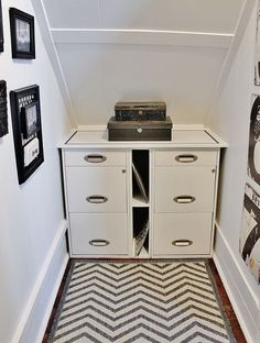 an old record player sitting on top of a cabinet in the corner of a room