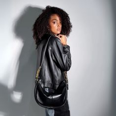 Our Hobo bag is the perfect accessory for those seeking a balance between style and functionality. This iconic curved design with a flexible structure fits comfortably on the shoulder, providing a feeling of lightness and comfort. Its versatile handle adjusts to your liking, allowing you to carry it as a short shoulder bag or crossbody, depending on the occasion.  With its relaxed silhouette and a touch of bohemian flair, this slouchy bag is ideal for those who appreciate fashion with a carefree air. Crafted from the highest quality leather, it is not only spacious and practical, but also a timeless piece that complements any style. The intricate and alluring hand-shaped hardware is inspired by palm reading and will surely captivate the imaginations of all who behold it. Exterior: Bovine s Modern Saddle Shoulder Bag For On-the-go, Modern On-the-go Saddle Shoulder Bag, Modern On-the-go Shoulder Saddle Bag, Versatile Saddle Bag With Removable Pouch For Office, Modern Soft Leather Saddle Bag, Modern Shoulder Bag With Single Strap For On-the-go, Versatile Saddle Shoulder Bag With Gold-tone Hardware, Chic Everyday Flap Bag With Zipper Closure, Versatile Saddle Bag With Single Shoulder Strap For Travel