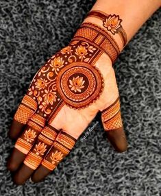 henna tattoo on the palm of someone's hand