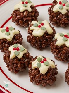 chocolate christmas cookies with white frosting on a red and white plate