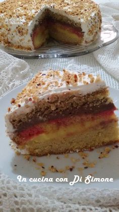 a piece of cake sitting on top of a white plate next to a slice of cake