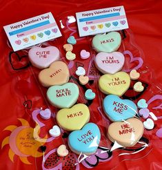 valentine's day cookies in the shape of heart shaped candies with words on them